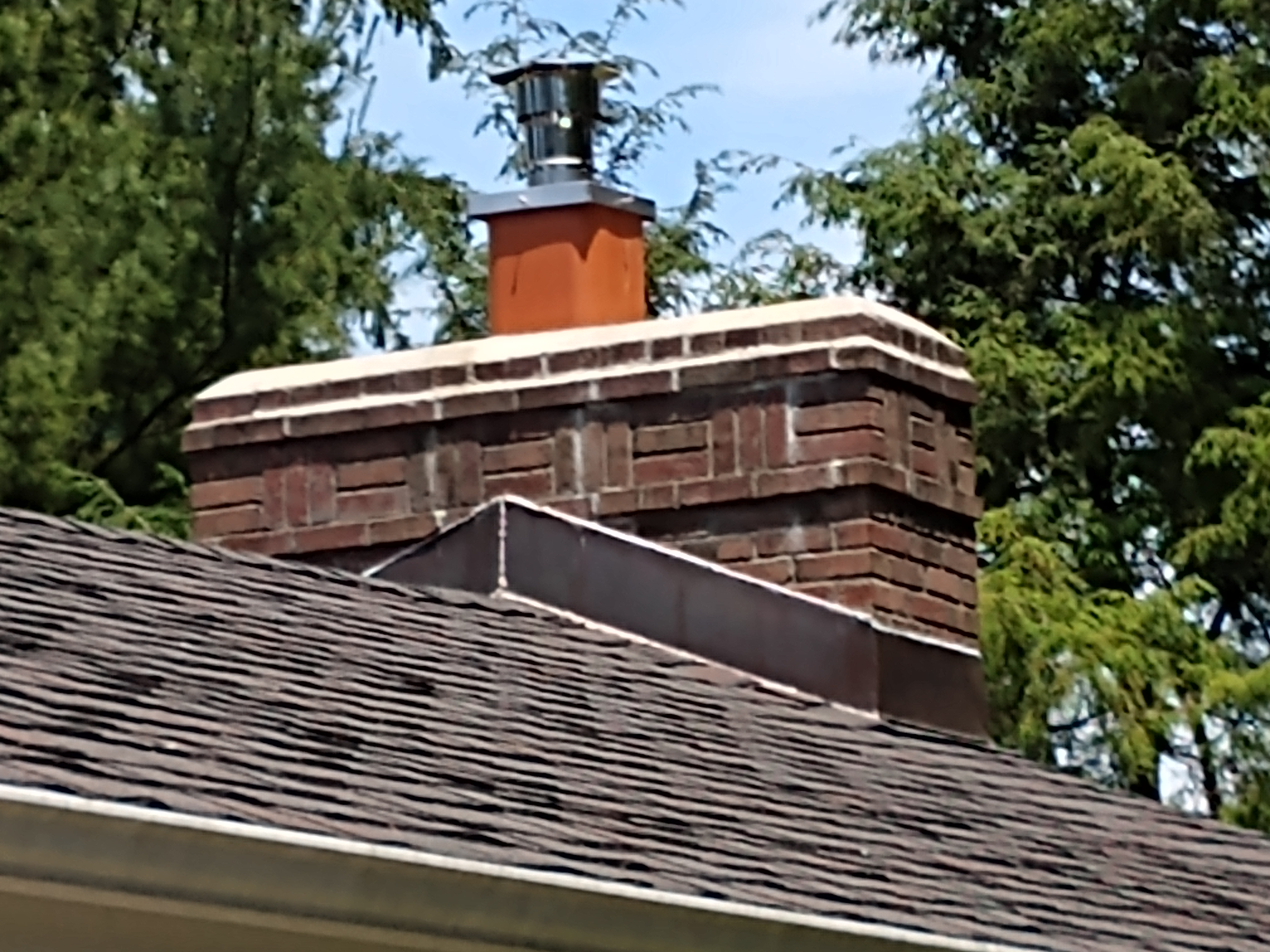 Stainless steel chimney cap with animal guard in Jericho, New York